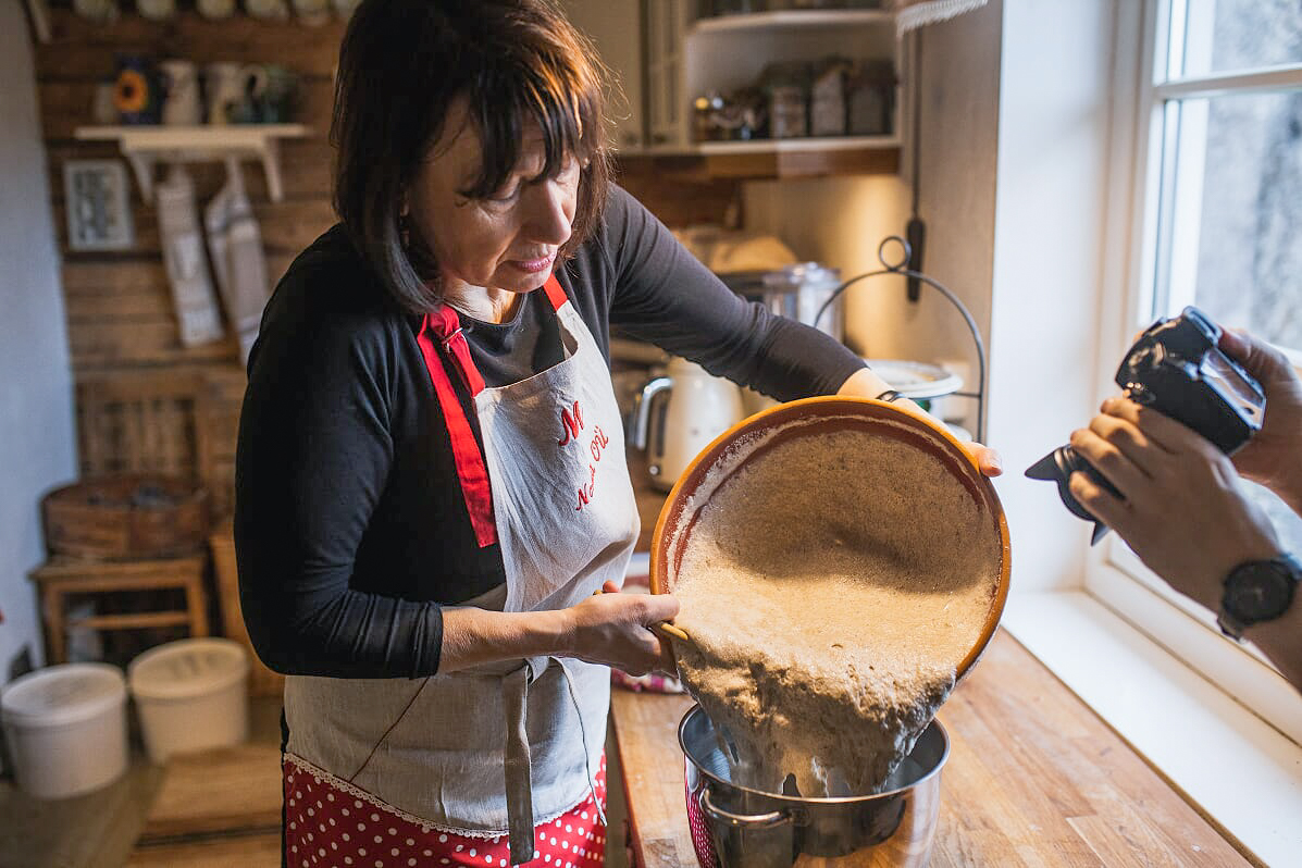 Mare Kallas, author of a book ‘Traditional Tastes of Laimjala’ baking bread.