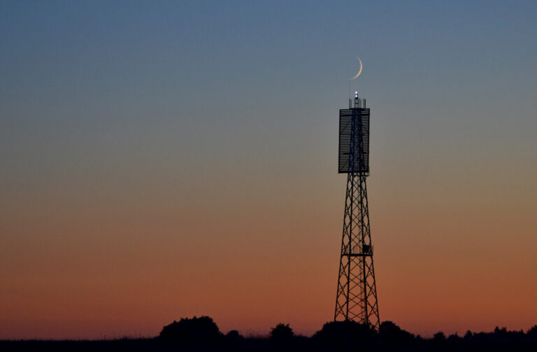 Visit Saaremaa - Roomassaare lighthouse and the moon - nature photo